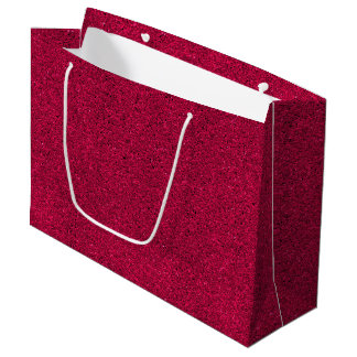Eine rote glitzernde Geschentktüte mit weißen Grif Große Geschenktüte