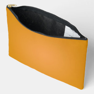 Eine senfgelbe rechteckige Tasche mit einem schwar