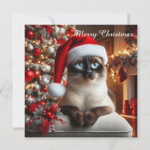 Eine siamesische Katze trägt einen Weihnachtsmann- Feiertagskarte