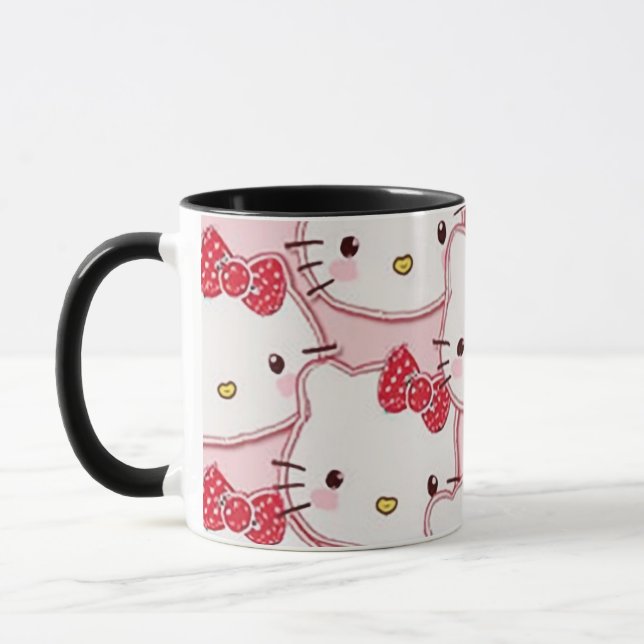 eine Tasse, die mit einem niedlichen Kätzchen entw Tasse (Links)
