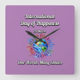 Eine Welt lächelt oft. Glückstag. Quadratische Wanduhr