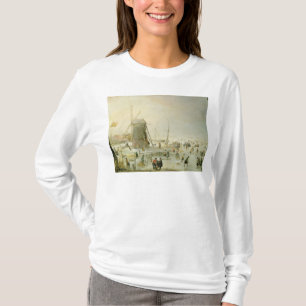 Eine Winterszene mit Skatern durch eine Windmühle T-Shirt
