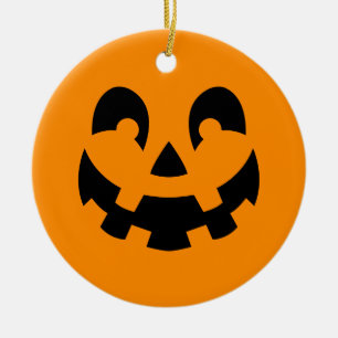 Einfache schwarze Kürbisgesicht an orangefarbenem  Keramik Ornament