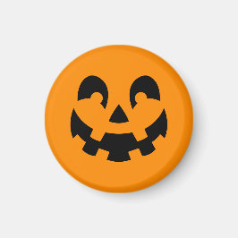 Einfache schwarze Kürbisgesicht an orangefarbenem Magnet