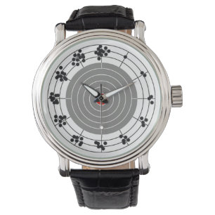 Einschusslöcher um das Ziel, ein Loch pro Stunde Armbanduhr
