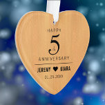 Elegant 5th Wood Wedding Anniversary Ornament<br><div class="desc">Celebrate the 5th wood wedding anniversary with this commemorative ornament! Elegant black serif and sans serif lettering on a light, faux wood grain background add a memorable touch for this special occasion and milestone. Customize with couple's names and wedding date. Reverse shows identical design. Use as is, or replace with...</div>