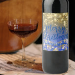 Elegant Blue Gold Snowflakes Merry Christmas Weinetikett<br><div class="desc">Elegant personalized Christmas wine label design featuring snowflakes, blurred lights and sparkles on a gold to blue gradient background. The text is fully customizable. To change it use the Personalize option. For more changes, such as changes to the font, font color or text layout, use the Edit design tool option....</div>
