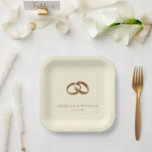 Elegant Gold Minimalist Rings Pappteller<br><div class="desc">This elegant wedding plate features a minimalist design with two interlocking golden rings set against a soft beige background, creating a luxurious and sophisticated look. The clean layout emphasizes the unity symbolized by the intertwined rings, while the classic serif font adds a touch of formality to the overall aesthetic. Perfect...</div>