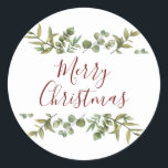 Elegant Merry Christmas Script Greenery Runder Aufkleber<br><div class="desc">Watercolor grüne Rahmen elegante Drehbuch Merry Weihnachtstypografie auf diesen eleganten Urlaubsticker. Entwickelt von Thisisnotme©</div>