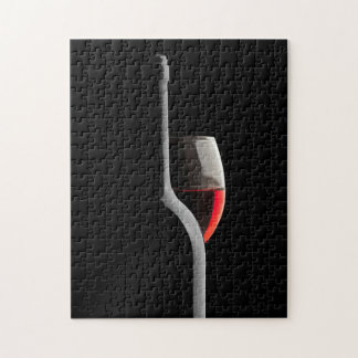 Elegant Red Wine Glass & Bottle. Black Background