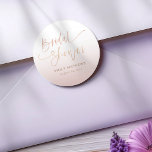 Elegant Rose Gold Gradient Bridal Shower  Runder Aufkleber<br><div class="desc">Elevate your event details with this elegant blush ombré bridal shower sticker, featuring modern calligraphy script and a soft romantic color palette. Designed with a delicate gradient from ivory to dusty blush, this chic sticker adds a sophisticated touch to favors, envelopes, and packaging. Perfect for bridal showers, weddings, and engagement...</div>