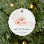 Elegant Script Baby's First Christmas Foto Cerami Keramik Ornament<br><div class="desc">Dieser runde Weihnachtsschmuck bietet dem Baby das erste Weihnachtsthema. Der Text "Mein 1. Weihnachten" erscheint in einer eleganten grünen Schrift. Mit dem benutzerdefinierten Text können Sie den Namen und das Jahr Ihres Neugeborenen hinzufügen.</div>