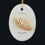 Elegant Tropical Junonia Florida Beach Shell Name Keramik Ornament<br><div class="desc">Elegant Tropical Junonia Florida Beach Shell Name Ornament. This perfect Junonia beach shell is photographed with high resolution macro photography and is featured in the Junonia Beach Shell Collection. Personalize with your First Initials and Name. Junonia mollusks live in Coastal Ocean depths of over 100 feet, so Beach Combers rarely...</div>