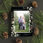 Elegant Winter Watercolor Greenery Botanical Photo Feiertagskarte<br><div class="desc">This elegant holiday photo card features a single vertical photo framed by beautiful watercolor eucalyptus, holly, and berries over a chic black background. The editable greeting on the front says "Happy Holidays". The back of the card is a coordinating foliage pattern, which can be removed if desired. You can also...</div>