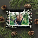 Elegant Winter Watercolor Greenery Botanical Photo Feiertagskarte<br><div class="desc">This elegant holiday photo card features a single horizontal photo framed by beautiful watercolor eucalyptus, holly, and berries over a chic black background. The editable greeting on the front says "Happiest Holidays". The back of the card is a simple black background to which you can add another photo and/or additional...</div>