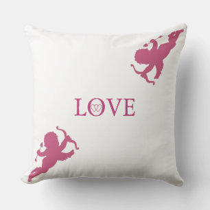 Elegante Cupidos in Roségold auf Weiß Kissen