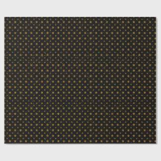 Elegante goldene Metallsterne auf schwarzem Gesche Geschenkpapier