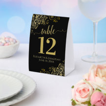Elegante Goldfrille auf der Black Wedding Tischnum