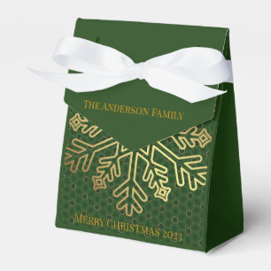 Elegante grüne und goldene Dekoration mit Schneefl Geschenkschachtel