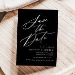 Elegante Kalligraphie Schwarz-Weiß-Hochzeit Save The Date<br><div class="desc">Elegant Save the Date mit "Save the Date" in einem weißen Kalligraphieskript mit schwarzem Hintergrund dargestellt. Personalisieren Sie die Kalligraphie Save the Date mit Ihren Namen,  Hochzeitstag und Ort,  und Hochzeitswebsite. Das nicht-Foto Design koordiniert mit unserer Hochzeitskollektion Elegant Calligraphy.</div>