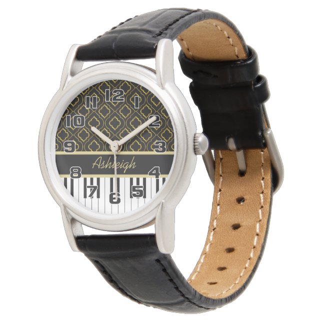 Elegante Klaviertasten mit goldener Quatrefolie au Armbanduhr (Schrägansicht)