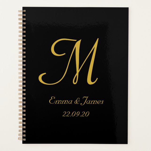 Elegante moderne Black Gold Monogram Script Hochze Planer (Vorderseite)
