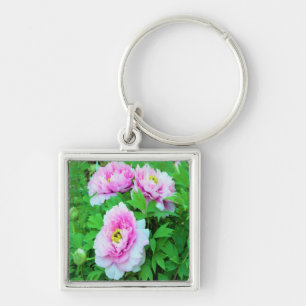 Elegante rosa Pfingstrosenblüten mit gelber Mitte Schlüsselanhänger