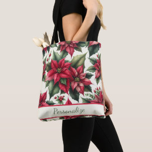 Elegante rote Poinsettien mit grünen Blättern pers Tasche