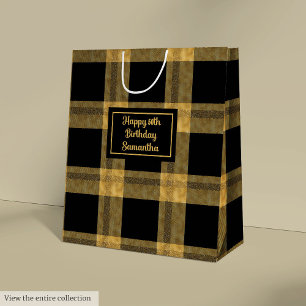 Elegante schwarze und goldene Geschenktasche mit i Mittlere Geschenktüte