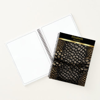 Elegante schwarze und goldene Haut einer giftigen Notizbuch