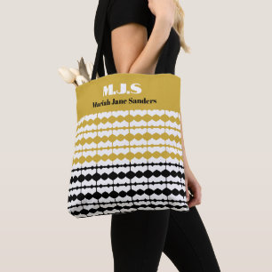 Elegante schwarze und goldene Musterinitialen und Tasche