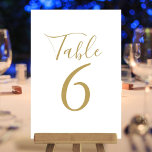 Elegante Script-Gold-Tischnummern Tischnummer<br><div class="desc">Diese eleganten Tischnummern in Gold und Weiß können in schicken Goldbuchstaben personalisiert werden. Entwickelt von Thisisnotme©</div>
