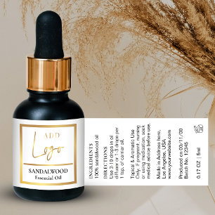 Elegante weiße und goldene Flasche mit ätherischen