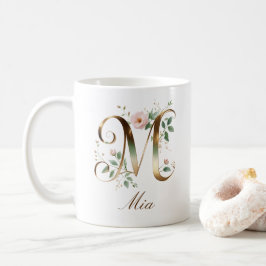 Eleganter Gold-Blumen-Initiale M-Monogramm-Becher Kaffeetasse