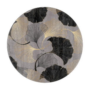 Eleganter goldener Ginkgo, Vintager Hintergrund. Schneidebrett