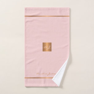 Eleganter, rosa goldfarbener, moderner mit Monogra Handtuch