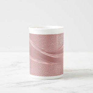 Eleganter rosa Schimmerhintergrund mit metallische Prozellantasse