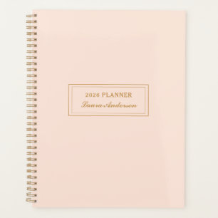 Eleganter rosa und goldener Planer 2026