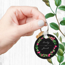 Eleganter rosafarbener Blumenreath Schwarzer Name 