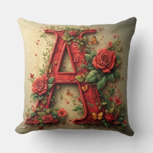 Eleganter roter Buchstabe A, umgeben von Rosen Kissen