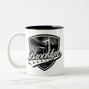 Elegantes Brooklyn-Swoosh-Logo-Design Zweifarbige Tasse