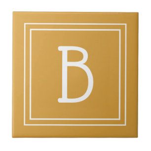 Elegantes monogrammiertes golden-gelbes und weißes fliese