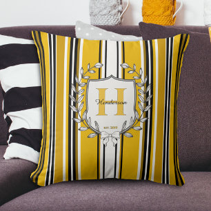 Elegantes Monogrammwappen mit gelben Streifen und Kissen