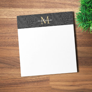 Elegantes schwarzes goldenes florales Schriftmonog Notizblock