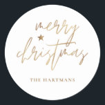 Elegantes Script Merry Christmas Gold Star White Runder Aufkleber<br><div class="desc">Diese stilvollen Weihnachtsaufkleber sind mit elegantem Typografie-Lesen,  "Frohe Weihnachten" in den Imitaten goldenen Folie,  zusammen mit einem kleinen Star-Akzent. Die Hintergrundfarbe kann auf jede gewünschte Farbe angepasst werden! Ideal für Umschlag Aufkleber,  Gastgeschenk-Etiketten oder Geschenkaufkleber!</div>