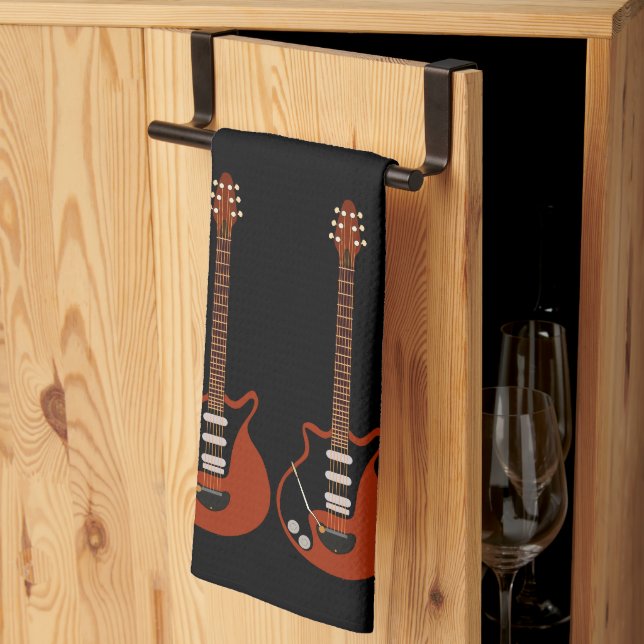 Elektrische Gitarren auf schwarzem Handtuch (Drittel gefaltet)