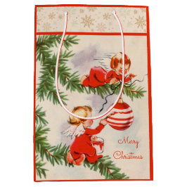 Engel dekorieren den Christbaum Mittlere Geschenktüte