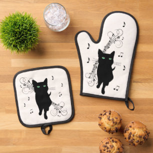 Ensemble De Gant De Cuisine Et De Manique Chat noir entouré de notes de musique murmurantes