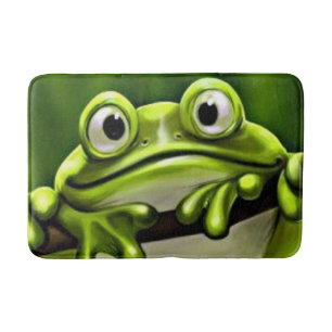 Entzückender lustiger niedlicher grüner Frosch im Badematte