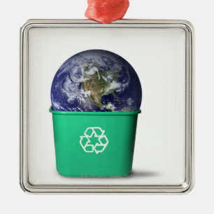 Erde in einem gerecyceltebehälter ornament aus metall